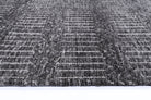 Alayah Geometric charcoal Rug side photo on light background